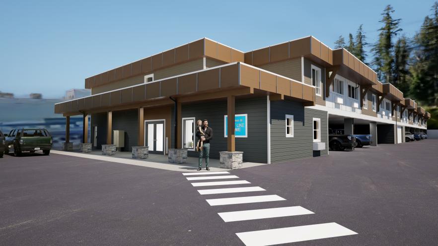 Modern two-story building with a crosswalk, surrounded by trees and parked vehicles.