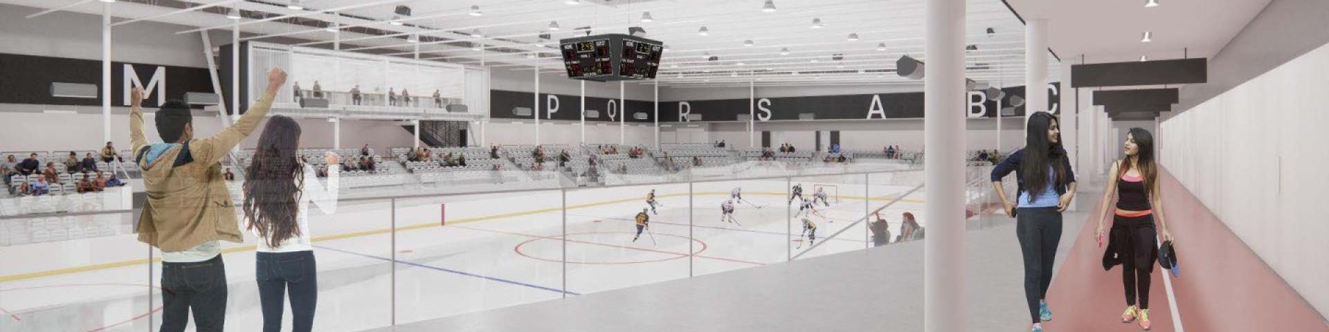 Indoor ice rink with people watching from the side and a hockey game in progress.