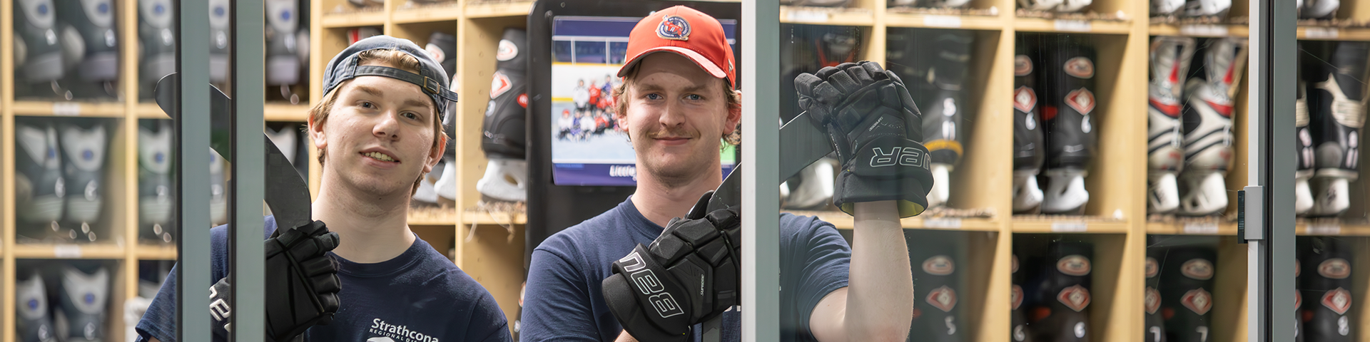 two staff members standing inside skate shop
