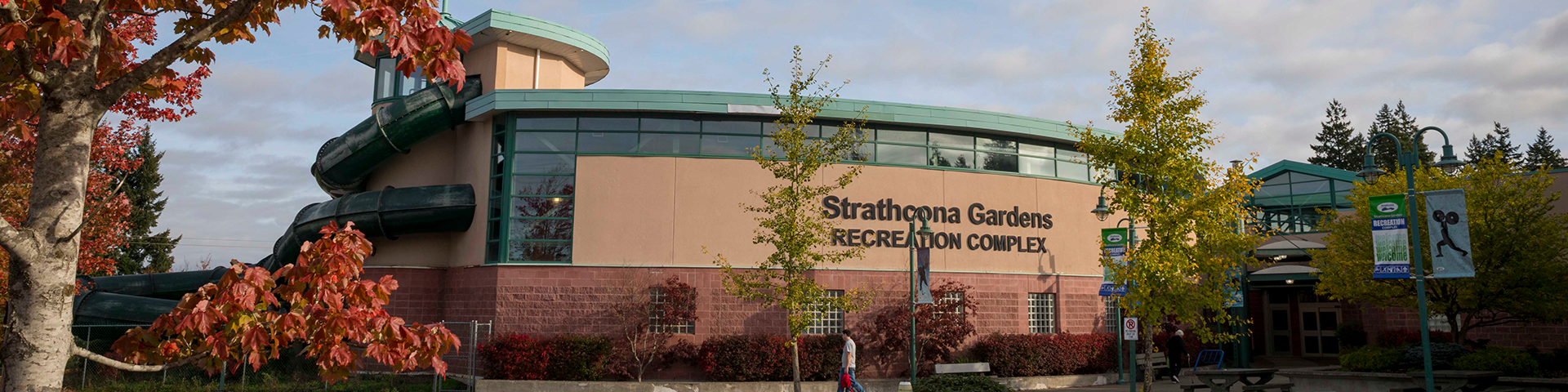 Front of old Strathcona Gardens pool building showing waterslide