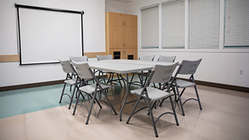 Table and chairs set up in Pinecrest Room